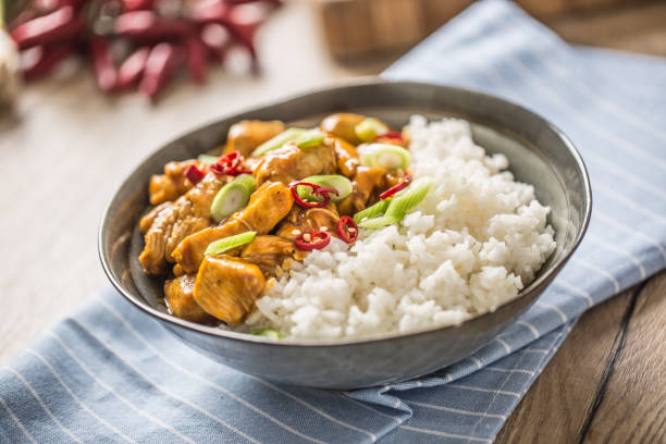 istock Chicken curry rice chili and young onion in bowl 1186925349