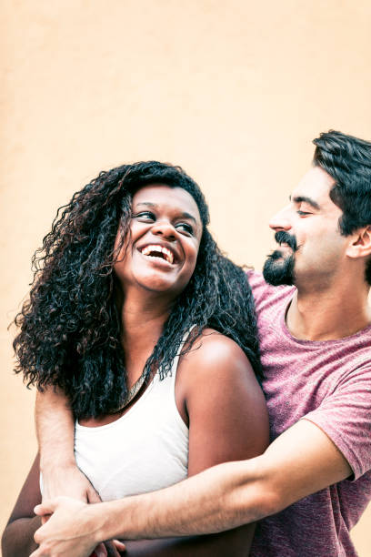 istock White guy embracing his black girlfriend 1186928323