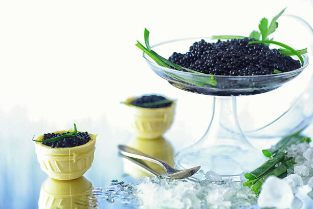 istock Fresh black fish roe. Beluga caviar served with ice. 1186928355