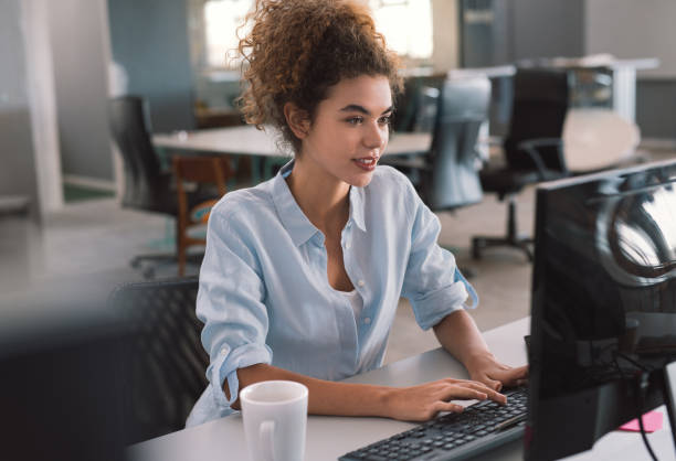 istock Young businesswoman working on a computer in an office 1186928384