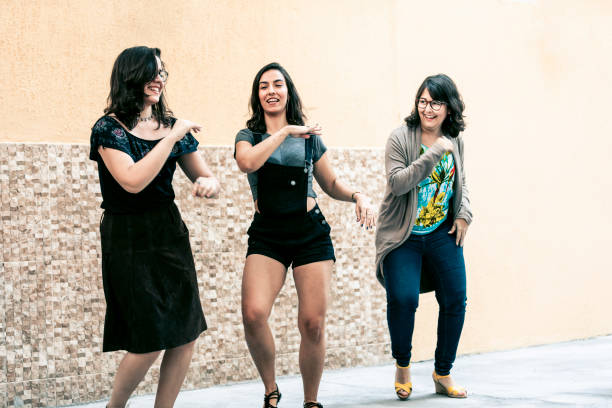 istock Girls dancing at a party 1186928392