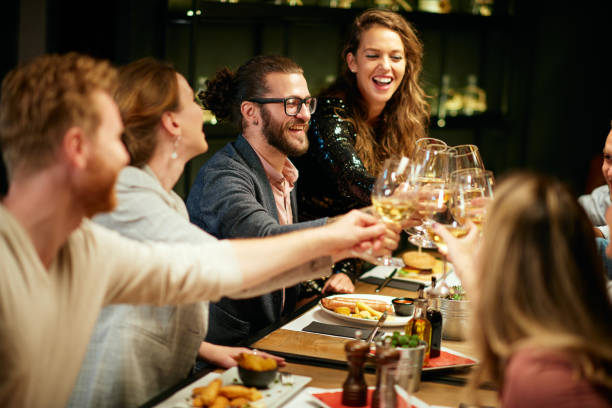 istock Friends toasting with wine in restaurant. 1186928696