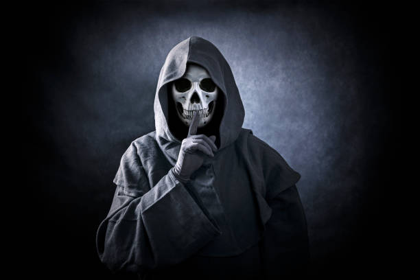 istock Grim reaper showing hush sign 1186930220