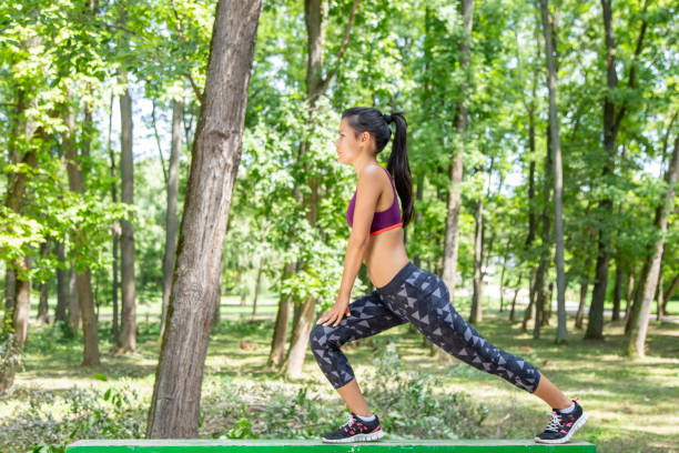 istock Young female runner warming up before running in forest 1186930475