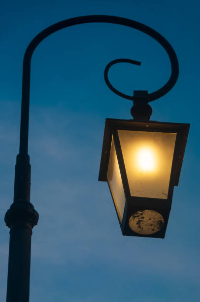 istock Retro style street lantern with blue sky 1186930847