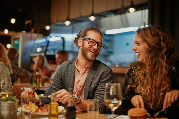 istock Friends having diner at restaurant. 1186931057