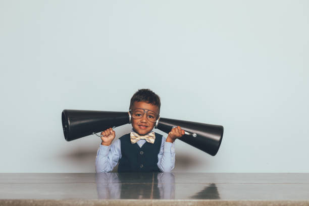 istock Young Nerd Boy Listening with Megaphones 1186931160