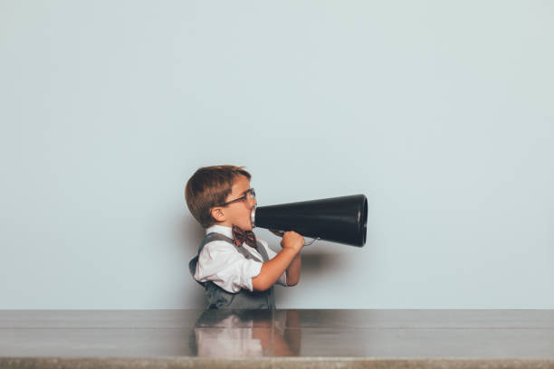 young nerd boy with megaphone - marketing megaphone child using voice imagens e fotografias de stock