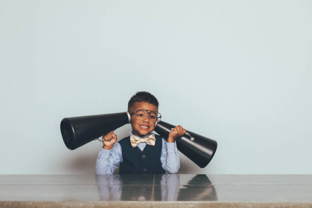 istock Young Nerd Boy Listening with Megaphones 1186931778