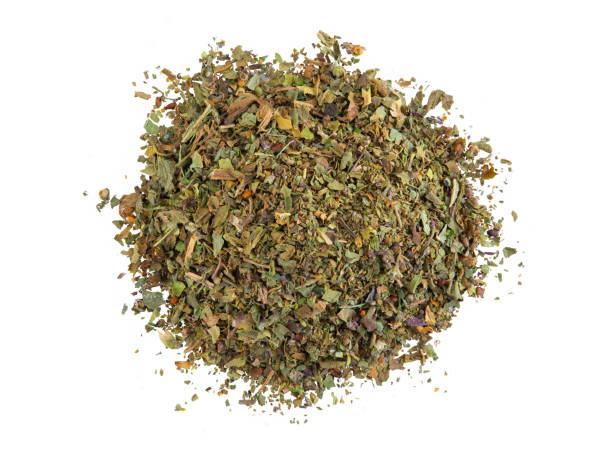 istock Some chopped, mixed herbs isolated on white background with copy space for text, images. Spices. Packaging concept. Close-up, top view 1186931815