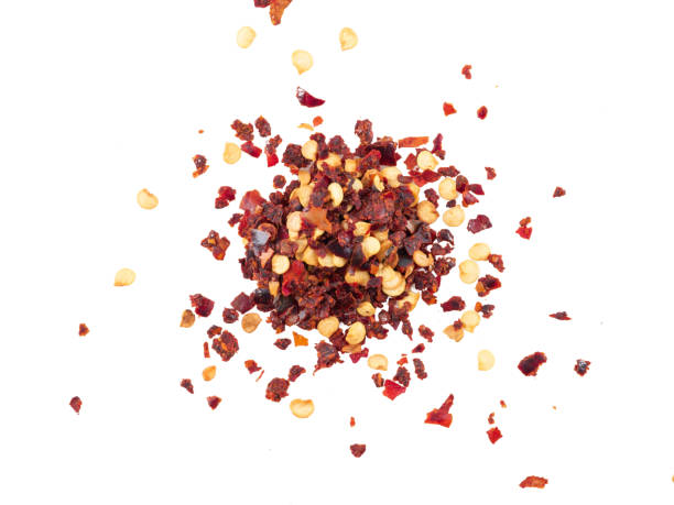 istock Chopped, dry chilli pepper isolated on white background with copy space for text, images. Spices and herbs. Packaging concept. Close-up, top view 1186932314