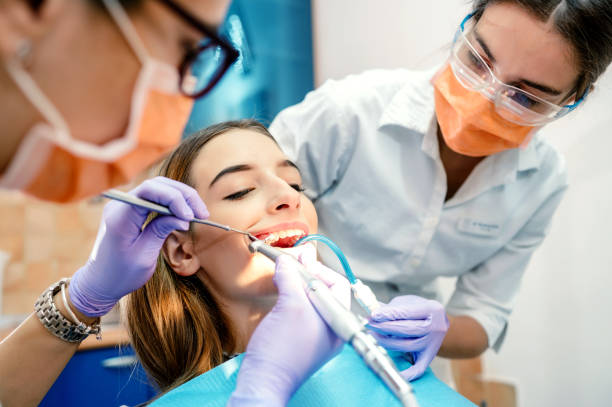 istock Young woman at dentist 1186934495