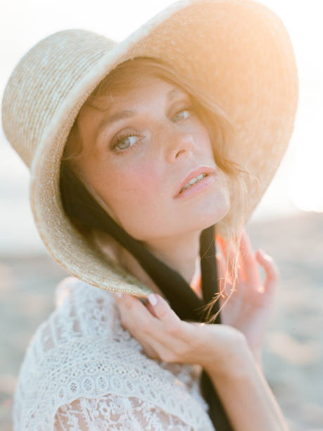 istock Woman on the beach in boho straw hat. 1186935727