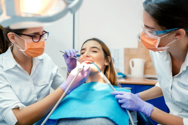 istock Young woman at dentist 1186936125