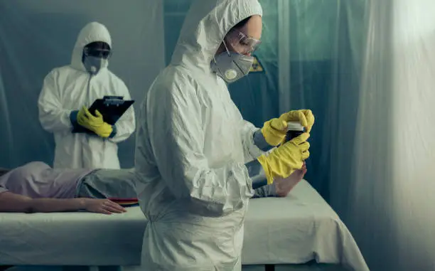 Photo of Doctors preparing medication for sick woman