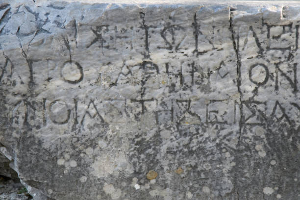istock Greek letters embossed on an old gray marble slab 1186936461
