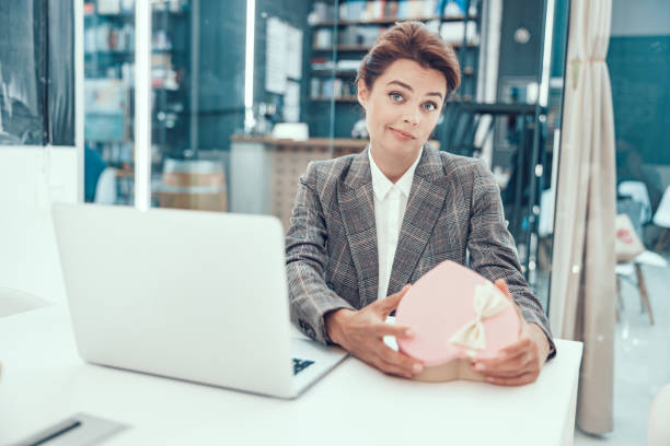 istock Strange romantic present at work stock photo 1186937572