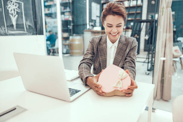 istock Funny unexpected present at work stock photo 1186937593
