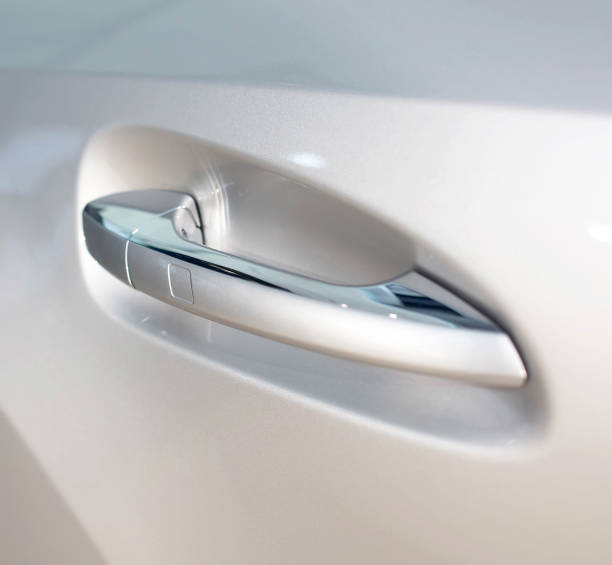 istock Modern door handle in a car with a button. Keyless Entry System 1186937671