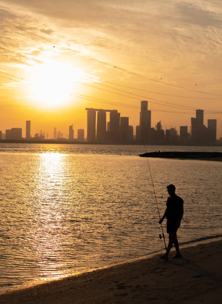 istock Angler is walking at the beach 1186942580