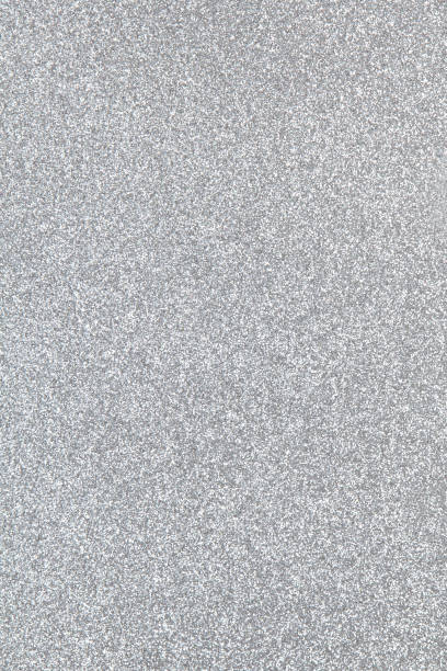 istock Silver coloured sparkling festive background, close-up. Copy space for text. Vertical. Celebration, holidays, sales, fashion concept, harvesting for mock up 1186942717