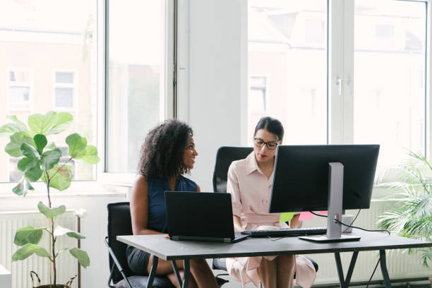 istock Two businesswomen working in office 1186942728