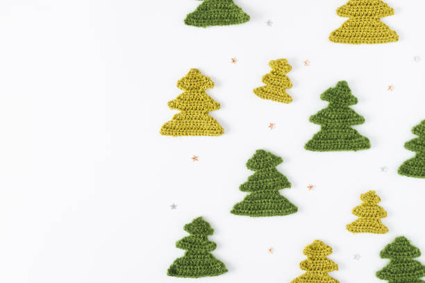 istock Christmas tree knitted from yarn on white background. 1186944207