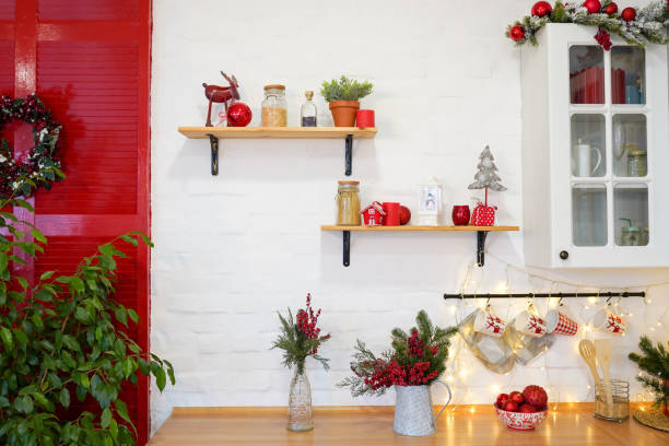 Kitchen cooking utensils in ceramic storage pot and Christmas decor