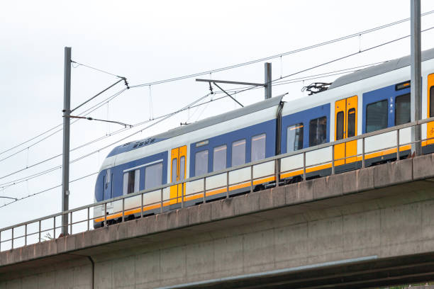 istock Skytrain in city Amsterdam. Passenger train in Netherlands. 1186946937
