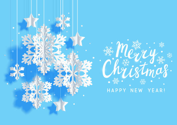istock Christmas greeting card with paper snowflakes and stars on light blue background 1186948578