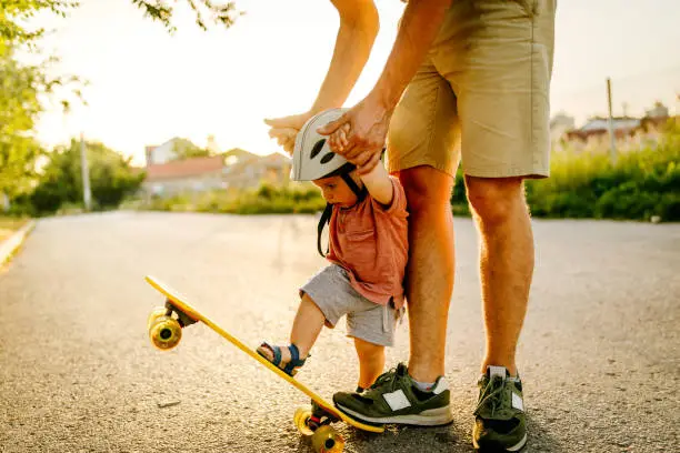 Photo of Baby's first skateboard ride