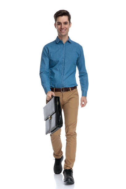 istock smart casual man smiling and holding suitcase 1186953091