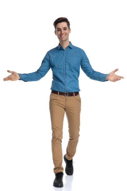 istock happy young man smiling and opening arms 1186953188
