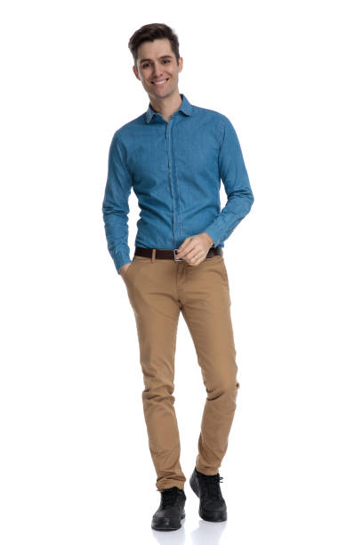 istock happy young smart casual man walking andwa smiling 1186953192