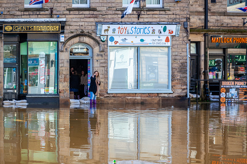 Local business owner outside her flooded shop premisses in Matlock Derbyshire Friday November 8th, 2019