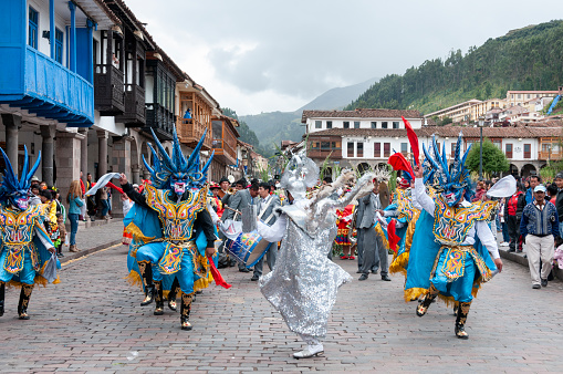A troupe of dancers at a traditional public dance festival in the Plaza Mayor Del Cusco in Cusco, Peru