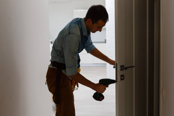 istock young repairman checking new door lock 1186954929