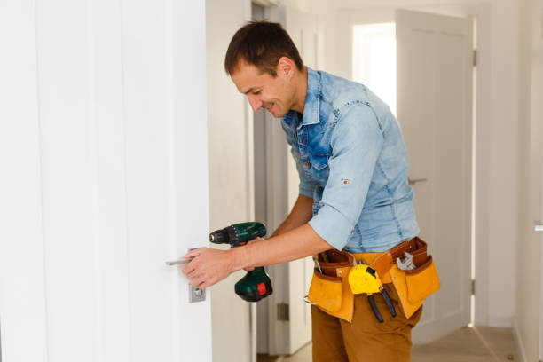 istock young repairman checking new door lock 1186954952
