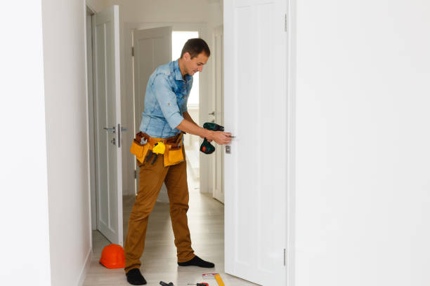 istock young repairman checking new door lock 1186955014