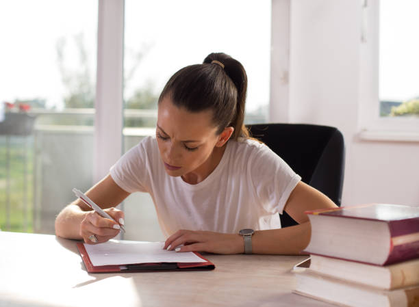 istock Student girl studying at home 1186956028