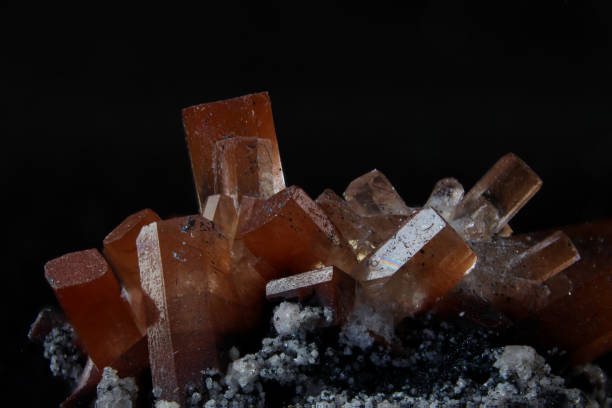 istock Orange and clear topaz on stone matrix 1186956518