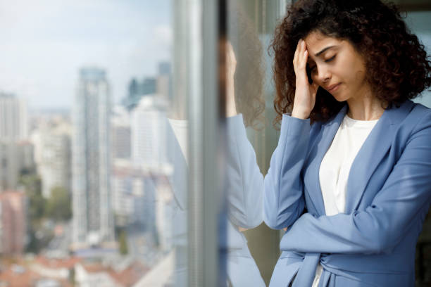 istock Stressed tired businesswoman 1186957551