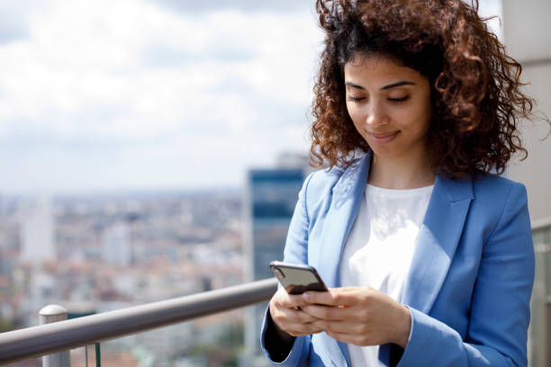 istock Young businesswoman using mobile phone 1186957697