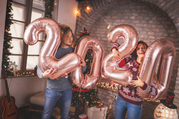 istock Couple holding giant 2020 balloons 1186958567