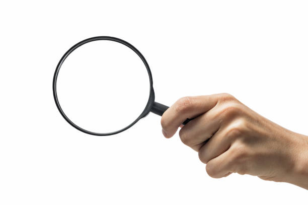 istock Magnifying glass in woman hand. 1186958710
