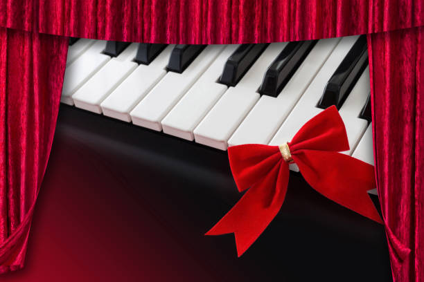 istock Piano and red velvet curtain 1186959018