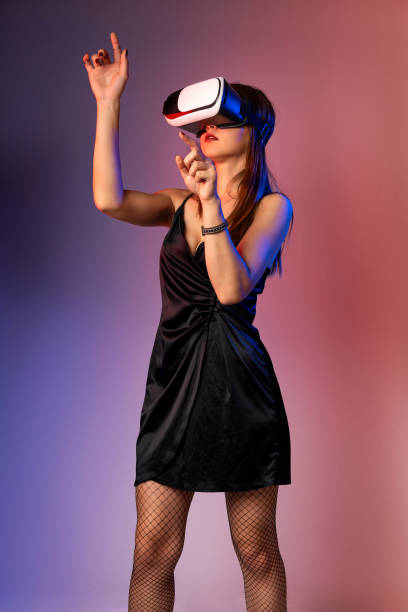 istock Attractive woman with virtual reality goggles 1186959129