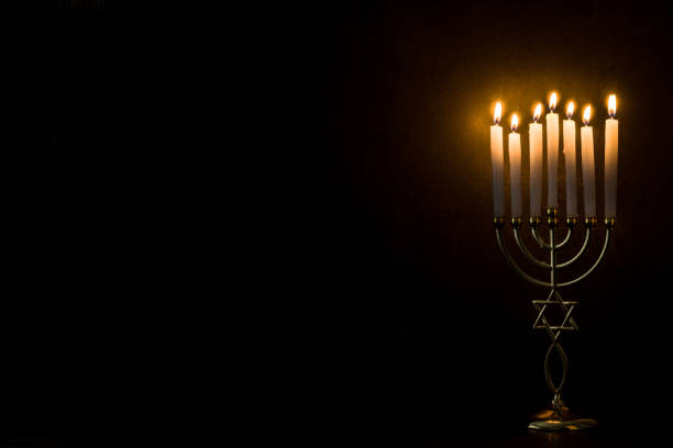 Jewish Hanukkah menorah on black background
