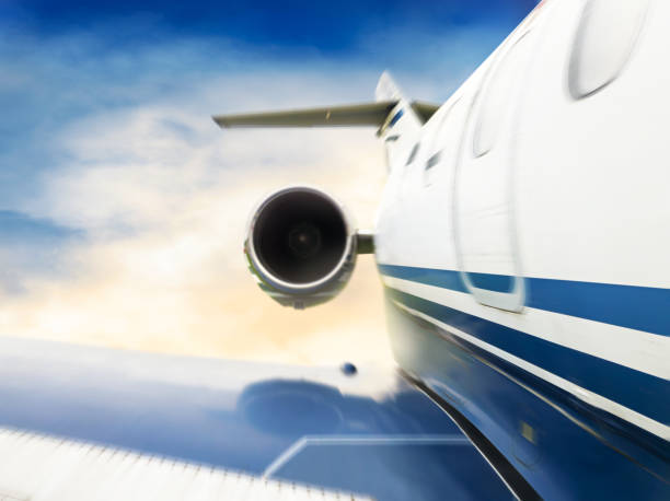 istock View of a jet airplane flying over a cloud sky. 1186962948