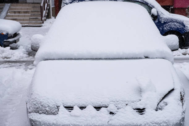 istock Car covered with fresh snow. snowstorm, poor visibility 1186964740